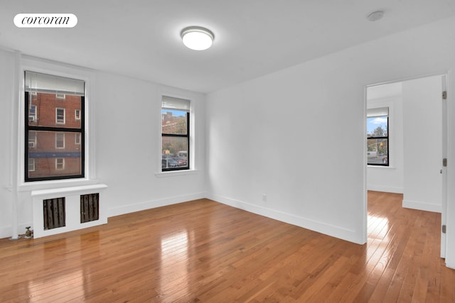 1494 Ocean Ave Unit 1J, New York City, NY 11230 - empty room with hardwood / wood-style flooring and baseboards