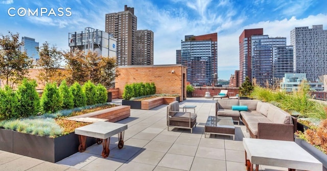view of patio with a skyline view and an outdoor living space