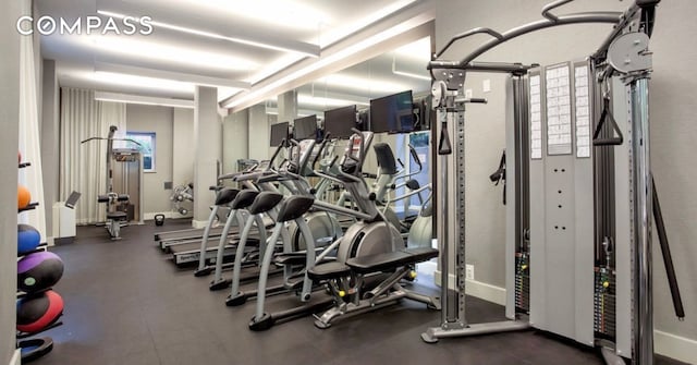 workout area featuring baseboards