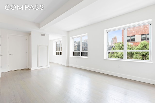 432 W 52nd St Unit 4H, New York City, NY 10019 - spare room featuring wood finished floors and baseboards