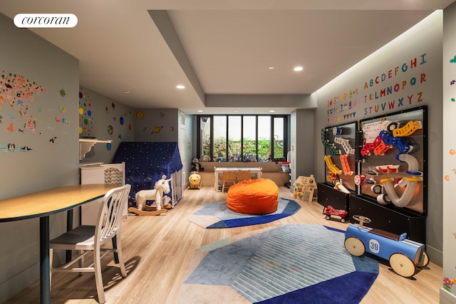 rec room featuring wood finished floors and recessed lighting