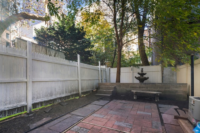 245 E 52nd St, New York City, NY 10022 - fenced backyard with a patio and ac unit