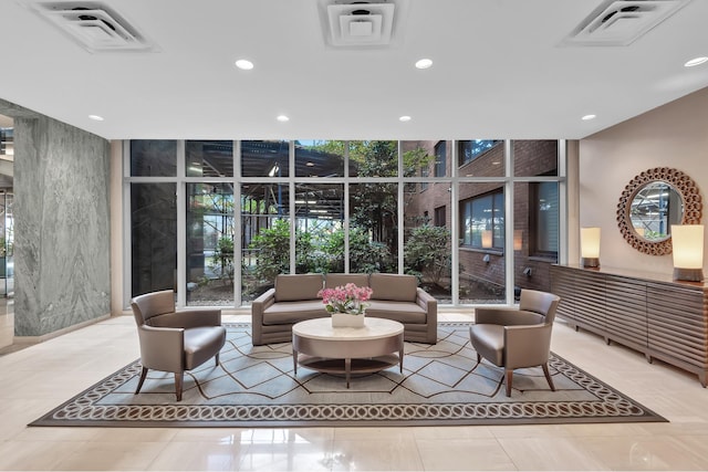 common area featuring a wall of windows and recessed lighting