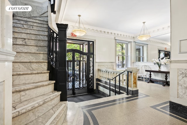 318 W 100th St Unit 1D, New York City, NY 10025 - stairway with speckle patterned floor, a wainscoted wall, and ornamental molding