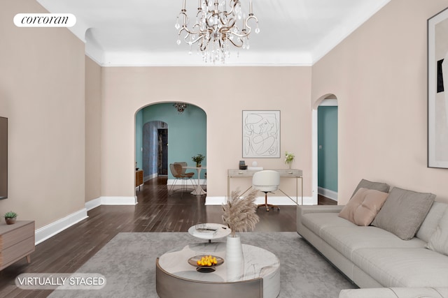 living room featuring arched walkways, wood finished floors, baseboards, and a chandelier