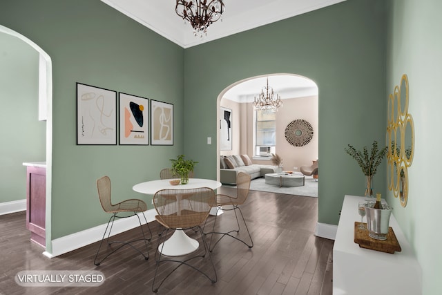 318 W 100th St Unit 1D, New York City, NY 10025 - dining room featuring arched walkways, a chandelier, baseboards, and wood finished floors
