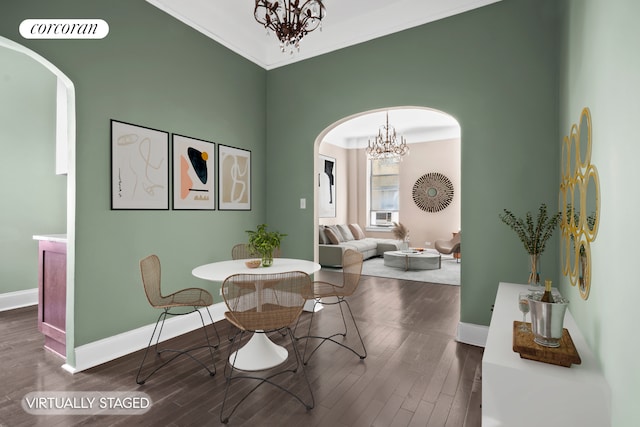 318 W 100th St Unit 1D, New York City, NY 10025 - dining space featuring arched walkways, a chandelier, baseboards, and wood finished floors