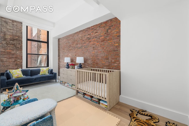51 Warren St Unit 3W, New York City, NY 10007 - bedroom with brick wall and wood finished floors