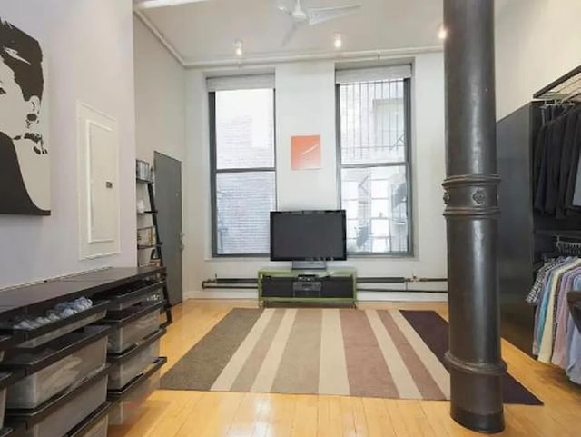 living room featuring wood finished floors and plenty of natural light