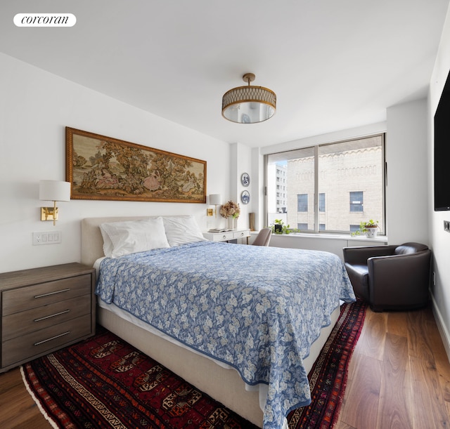 bedroom with wood finished floors