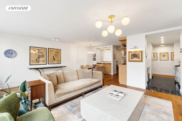 170 E 87th St Unit W7C, New York City, NY 10128 - living area with a chandelier, wood finished floors, and baseboards