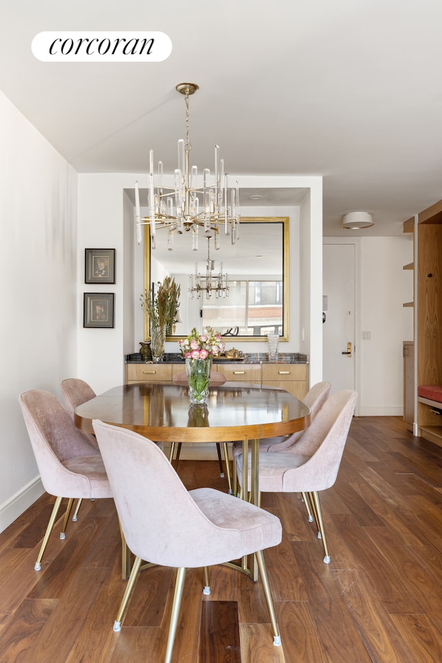 dining space with dark wood-type flooring and baseboards