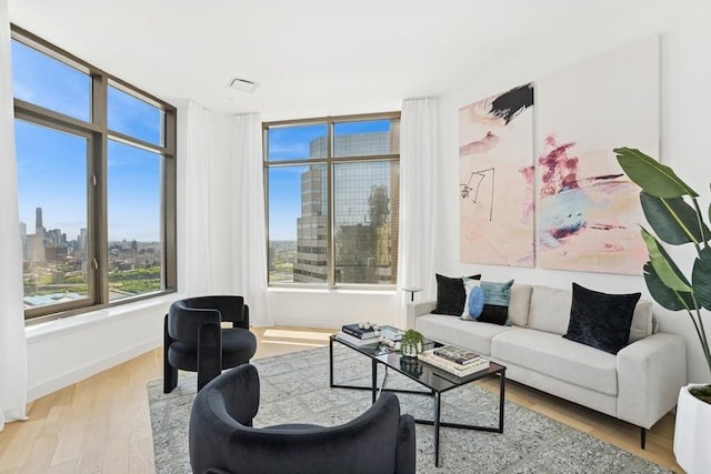 75 Wall St Unit Phd2, New York City, NY 10005 - living room with wood finished floors and a city view