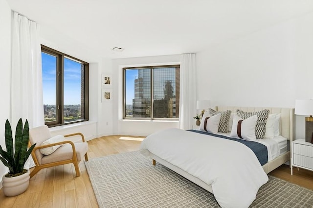 75 Wall St Unit Phd2, New York City, NY 10005 - bedroom featuring wood finished floors