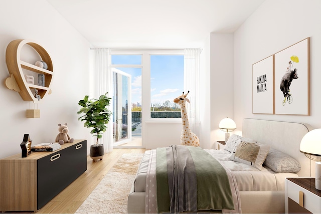bedroom featuring light wood-style floors