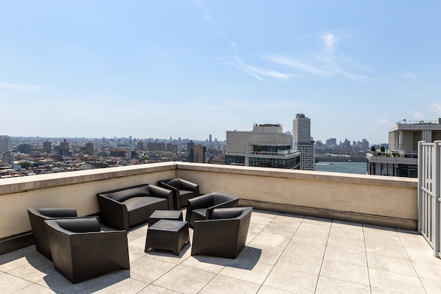 view of patio / terrace featuring a skyline view and a balcony