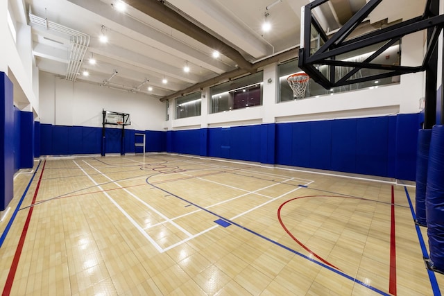 view of basketball court featuring community basketball court and fence