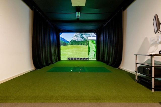 recreation room with carpet floors, golf simulator, and baseboards