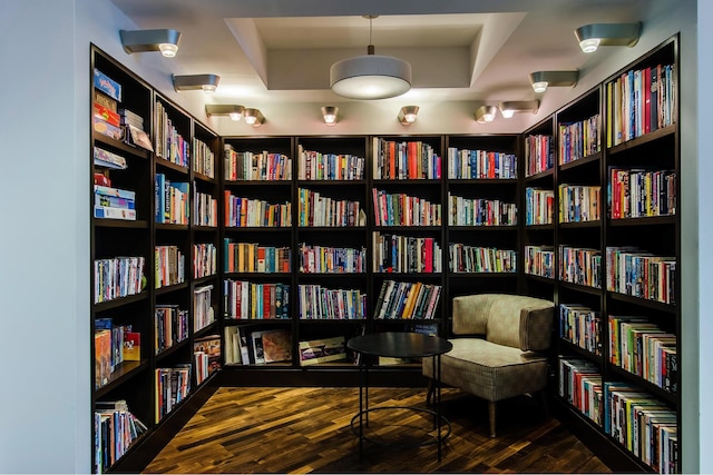 34 N 7th St Unit 3Q, New York City, NY 11249 - sitting room featuring wall of books and wood finished floors
