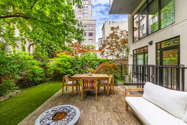318 E 81st St Unit 1, New York City, NY 10028 - view of patio with an outdoor living space with a fire pit and outdoor dining space