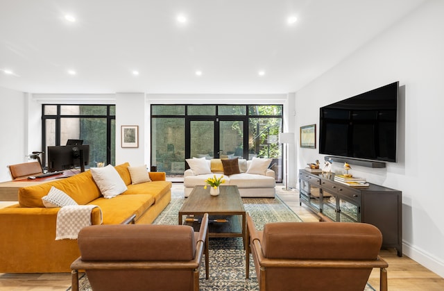 318 E 81st St Unit 1, New York City, NY 10028 - living area featuring recessed lighting, light wood-type flooring, and baseboards