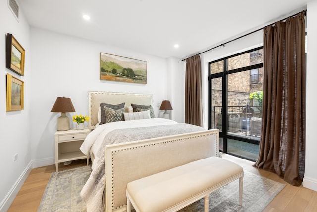318 E 81st St Unit 1, New York City, NY 10028 - bedroom featuring access to exterior, light wood finished floors, recessed lighting, and baseboards