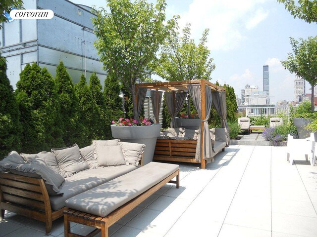 340 E 23rd St Unit Ph2F, New York City, NY 10010 - view of patio / terrace with an outdoor hangout area, a pergola, and a view of city