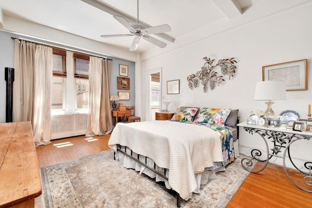 67 Park Ave Unit 6-C, New York City, NY 10016 - bedroom featuring hardwood / wood-style floors, multiple windows, beamed ceiling, and a ceiling fan