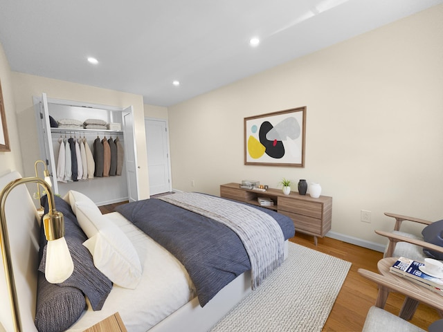 12-06 Robin Ln Unit 1028, New York City, NY 11360 - bedroom featuring wood finished floors, a closet, baseboards, and recessed lighting