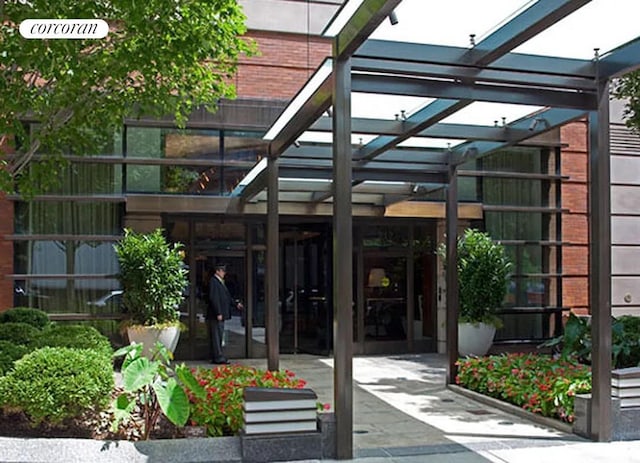 entrance to property featuring a pergola