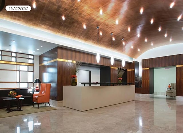 reception area with vaulted ceiling