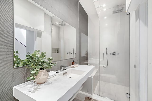 262 W 25th St, New York City, NY 10001 - bathroom featuring a stall shower, vanity, and tile patterned flooring