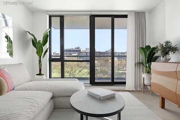 living room featuring a view of city and carpet flooring