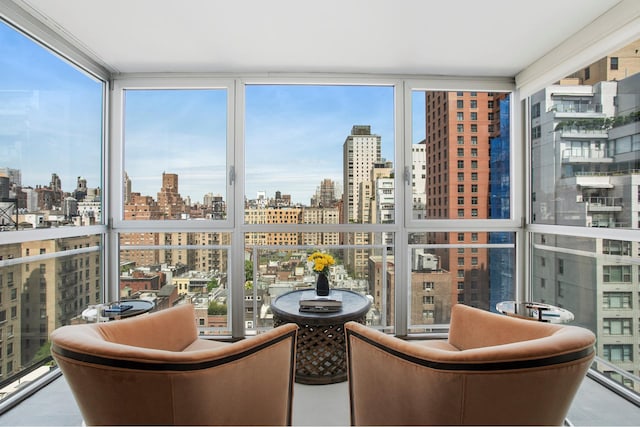 sunroom featuring a skyline view and healthy amount of natural light