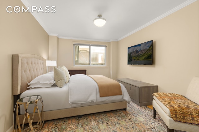 bedroom featuring crown molding and wood finished floors