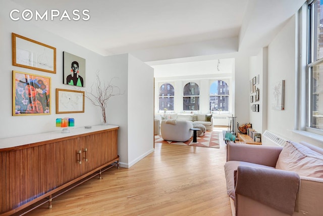 35 E 12th St Unit 8C, New York City, NY 10003 - living area featuring healthy amount of natural light and light wood-style flooring