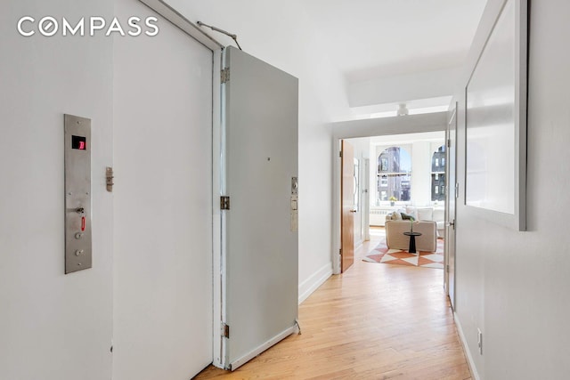 35 E 12th St Unit 8C, New York City, NY 10003 - hall featuring light wood finished floors and baseboards