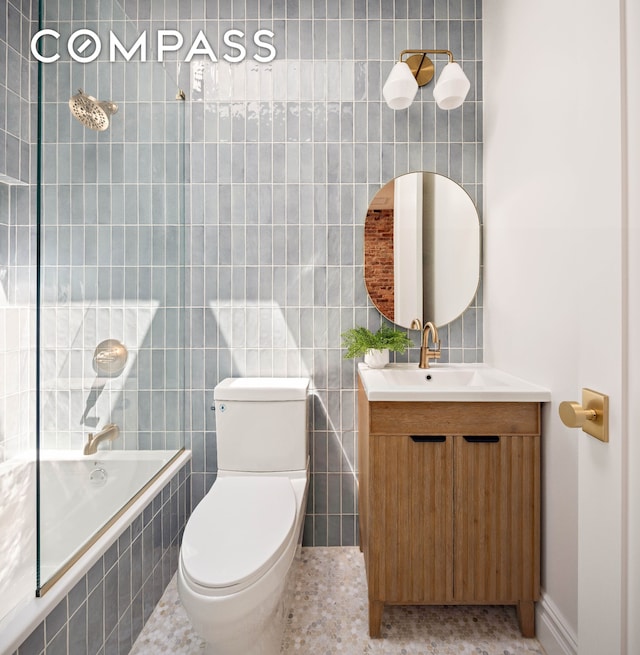 151 Chauncey St, New York City, NY 11233 - full bathroom featuring vanity, tile walls, toilet, and tiled shower / bath