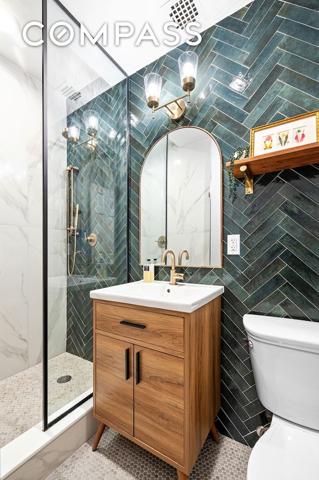 315 W 99th St Pha, Pha, New York City, NY 10025 - bathroom featuring tile walls, vanity, a tile shower, tile patterned floors, and toilet