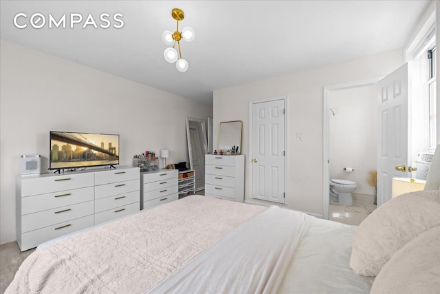 bedroom featuring ensuite bathroom and light marble finish floors