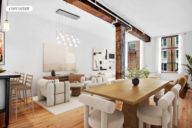 124 W 24th St Unit 4B, New York City, NY 10011 - dining space with wood finished floors and beamed ceiling