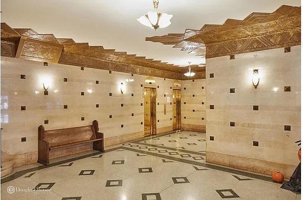 141 E 3rd St Unit 3H, New York City, NY 10009 - bathroom featuring a chandelier and inlaid floor details