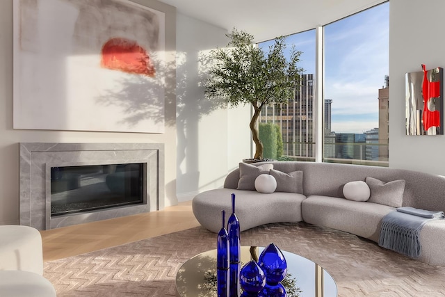 living room with a premium fireplace and floor to ceiling windows