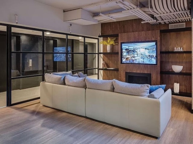 building lobby with wooden walls and beamed ceiling