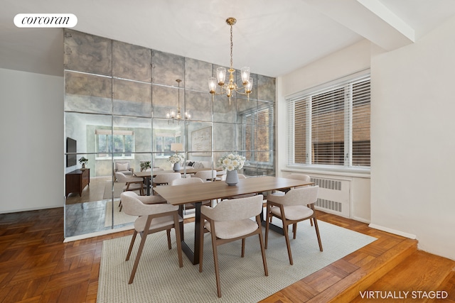 36 Sutton Pl S Unit 2A, New York City, NY 10022 - dining space featuring radiator heating unit and a chandelier