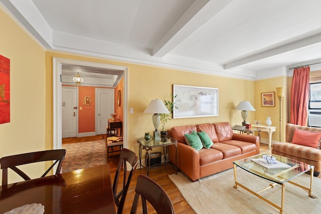 205 E 78th St Unit 12J, New York City, NY 10021 - living room featuring wood finished floors, beamed ceiling, and baseboards