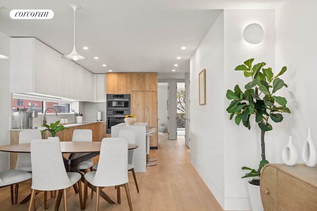 1110 Manhattan Ave Unit 2, New York City, NY 11222 - dining room with recessed lighting, light wood-style flooring, and baseboards