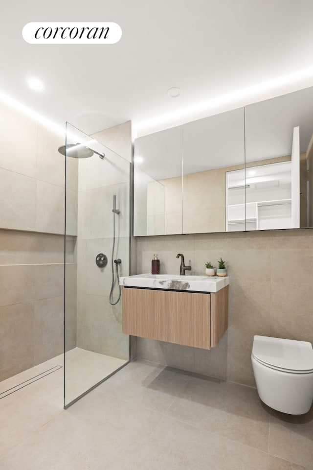 1110 Manhattan Ave Unit 2, New York City, NY 11222 - bathroom with tile walls, tile patterned flooring, a walk in shower, vanity, and toilet