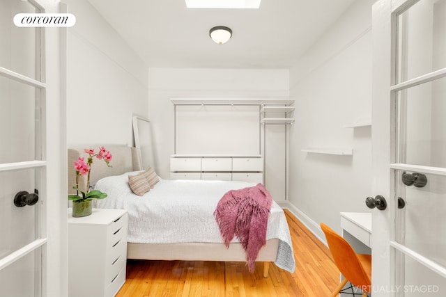 bedroom with wood finished floors