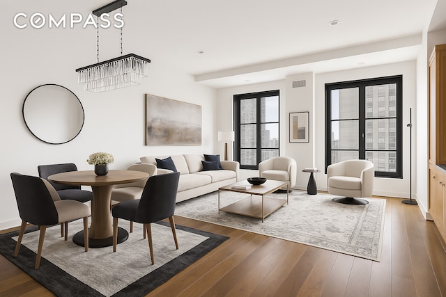 living room with wood finished floors and baseboards
